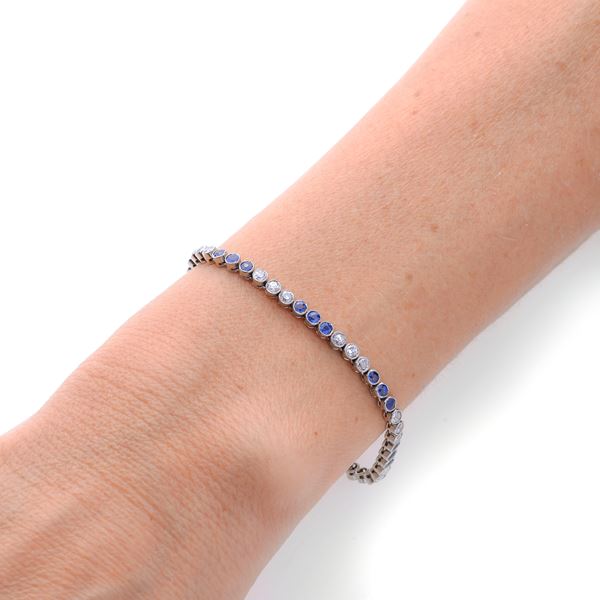 Tennis bracelet in white gold, diamonds and sapphires