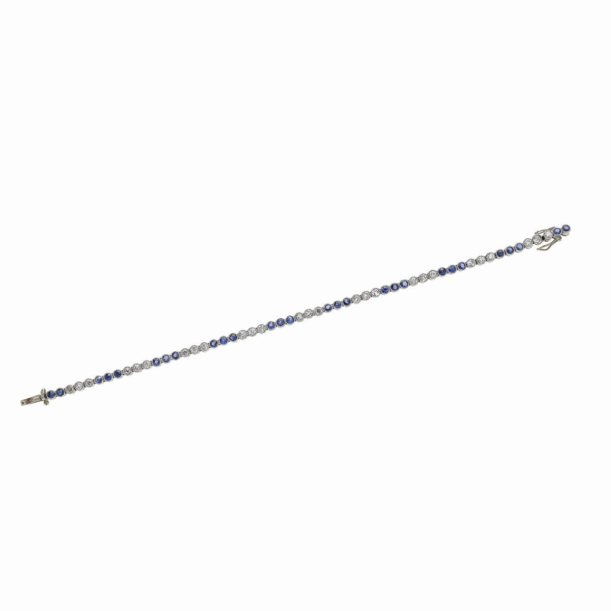 Bracciale tennis in oro bianco, diamanti e zaffiri