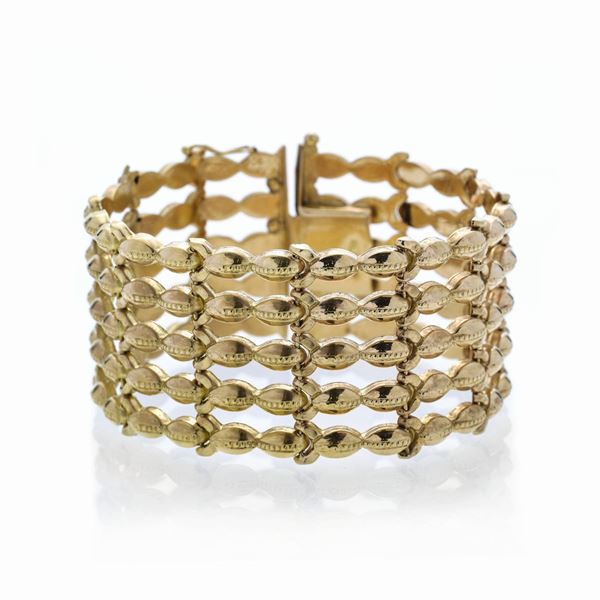 Alto bracciale in oro giallo