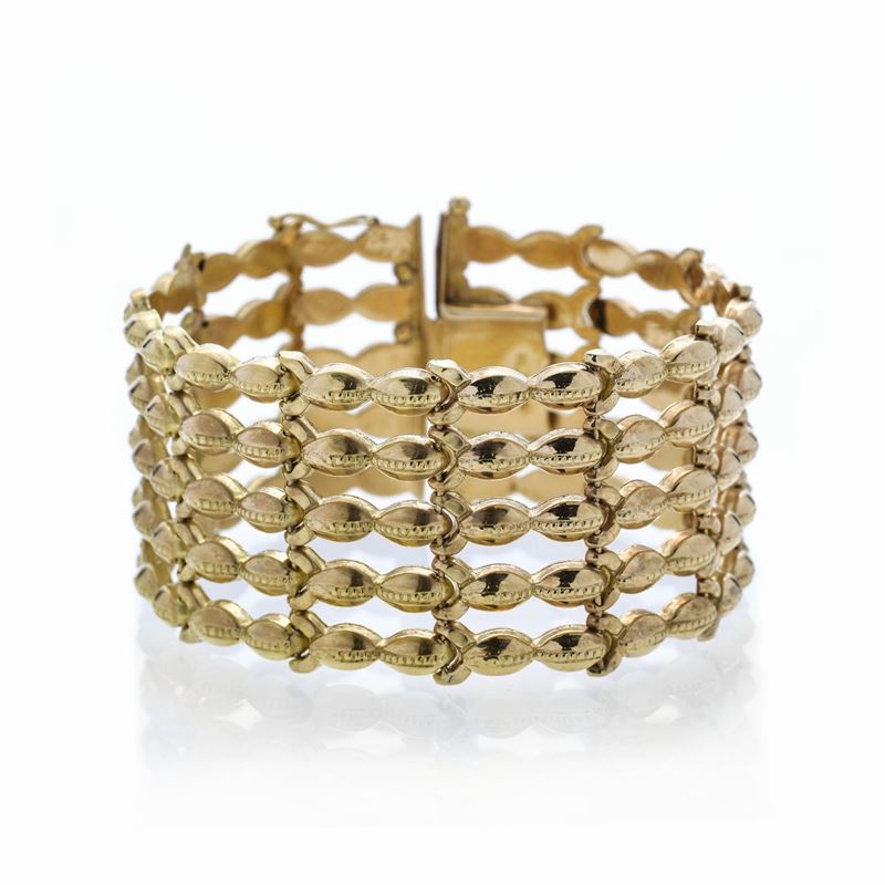 Alto bracciale in oro giallo