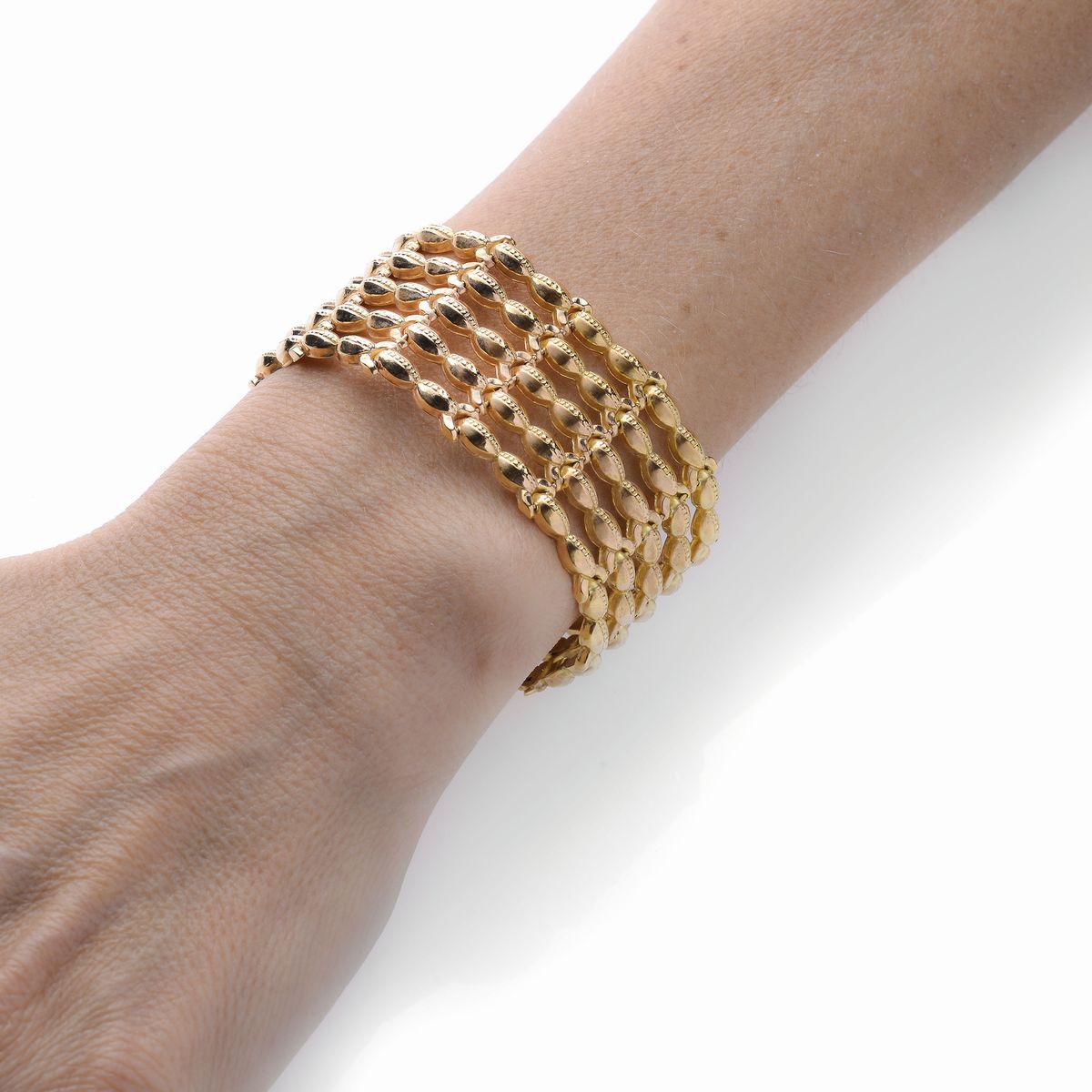 Alto bracciale in oro giallo