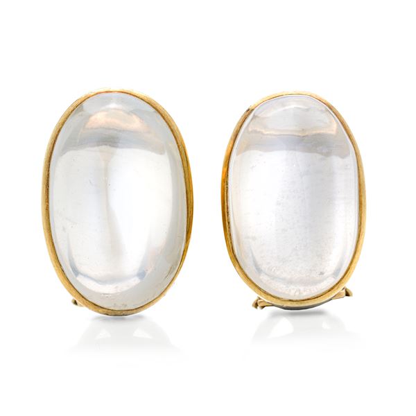 Pair of oval clip earrings in yellow gold and moonstone