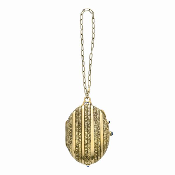 Powder compact in yellow gold and sapphires