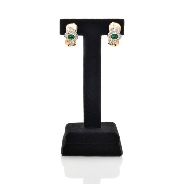 Pair of clip earrings in yellow gold, white gold, diamonds and emeralds