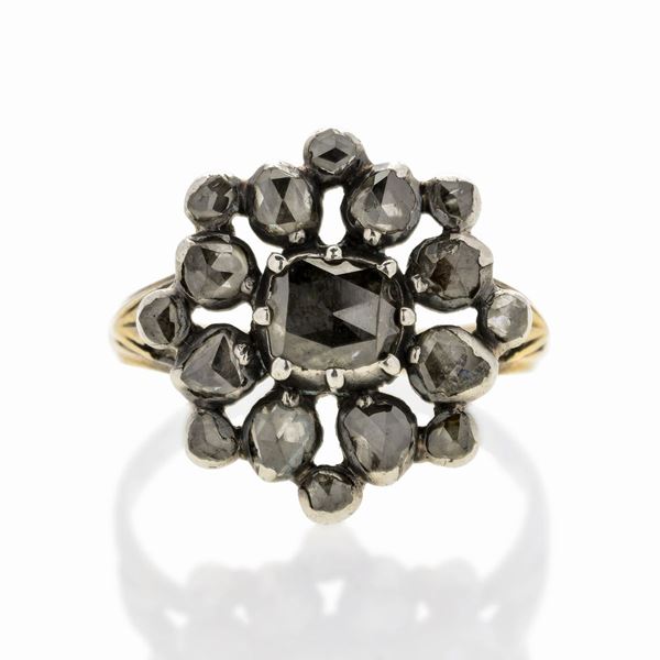 Ring in low title gold, silver and diamond
