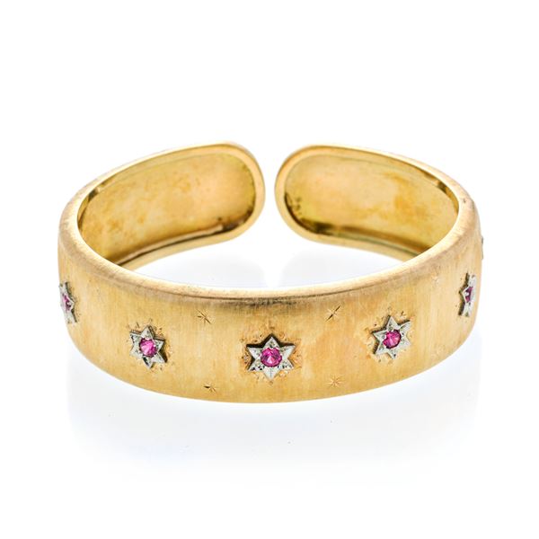 Rigid bracelet in yellow gold, white gold and red stones