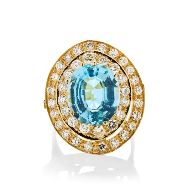 Ring in yellow gold, diamonds and blue topaz