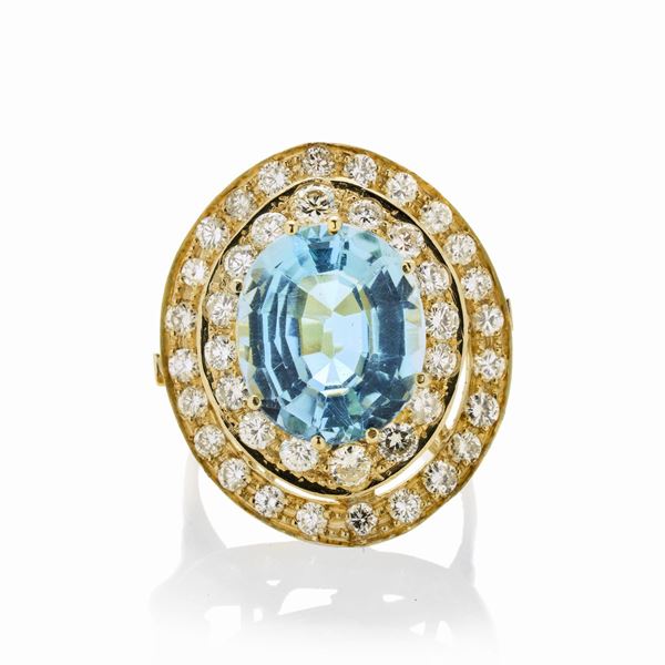Ring in yellow gold, diamonds and blue topaz
