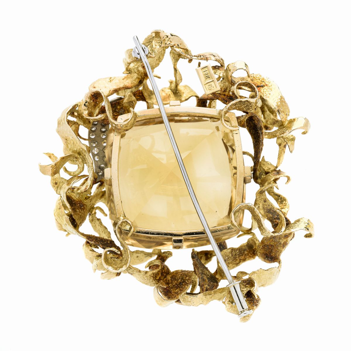 Particolare spilla in oro giallo, oro bianco, diamanti e quarzo citrino naturale