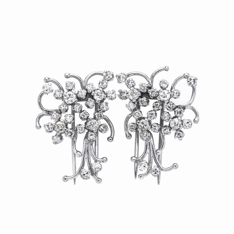 Coppia di clips in platino e diamanti