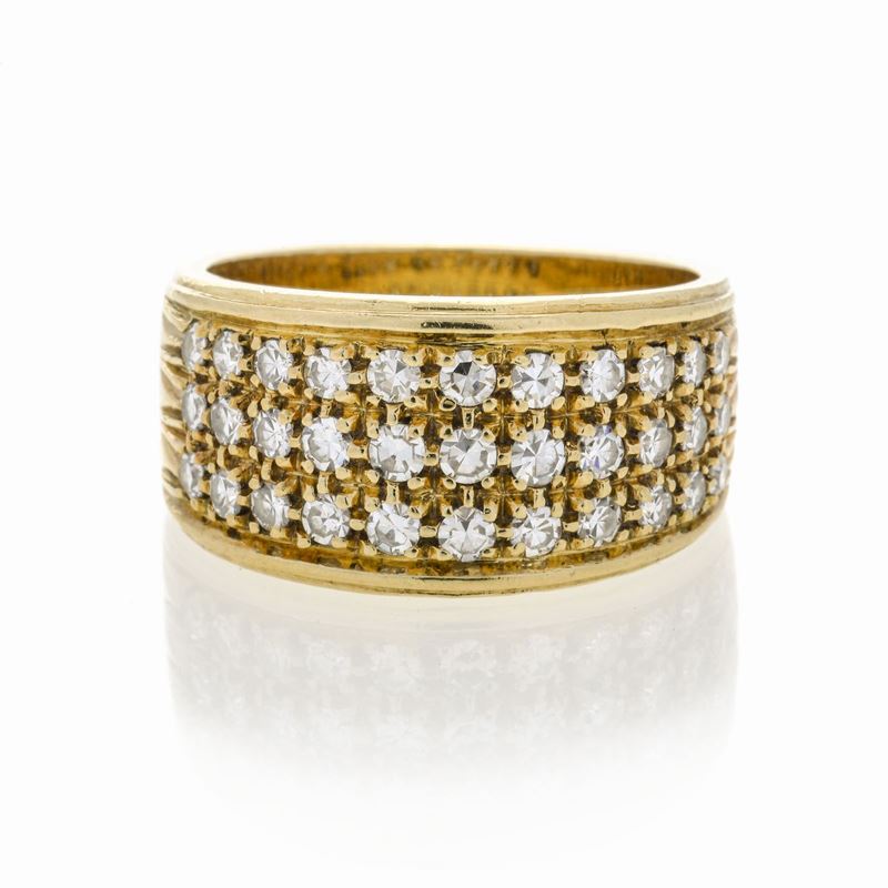 Anello a fascia in oro giallo e diamanti