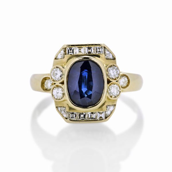 Anello in oro giallo, diamanti e zaffiro