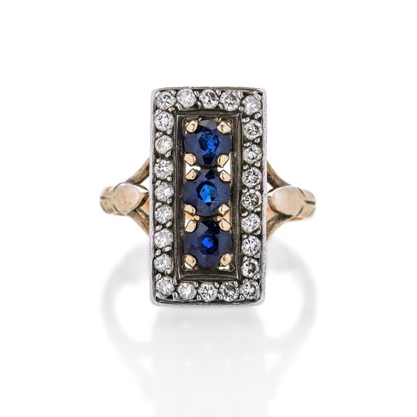 Ring in yellow gold, silver, diamonds and shappires