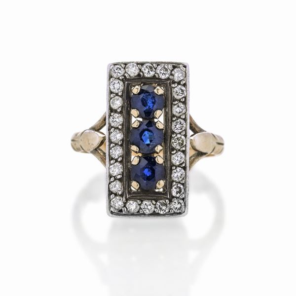 Ring in yellow gold, silver, diamonds and shappires