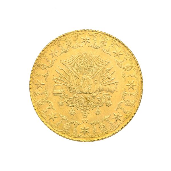 Large coin in yellow gold