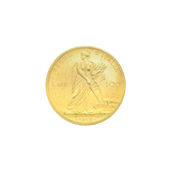 100 lire coin in yellow gold