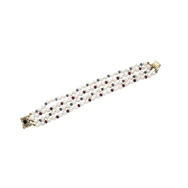 Bracelet in yellow gold, cultured pearls, rubies and sapphires