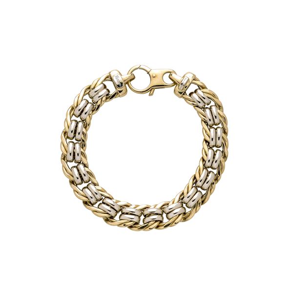 Intertwined link bracelet in white and yellow gold