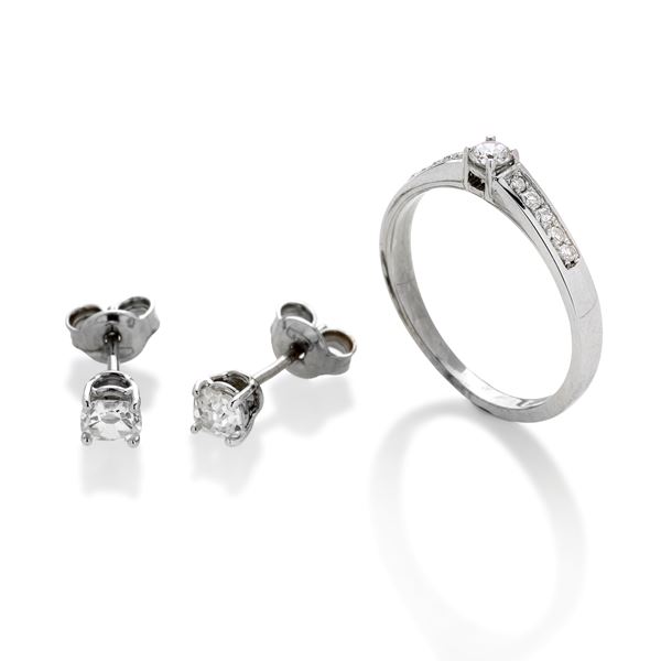 Pair of light point earrings and ring in white gold and diamonds