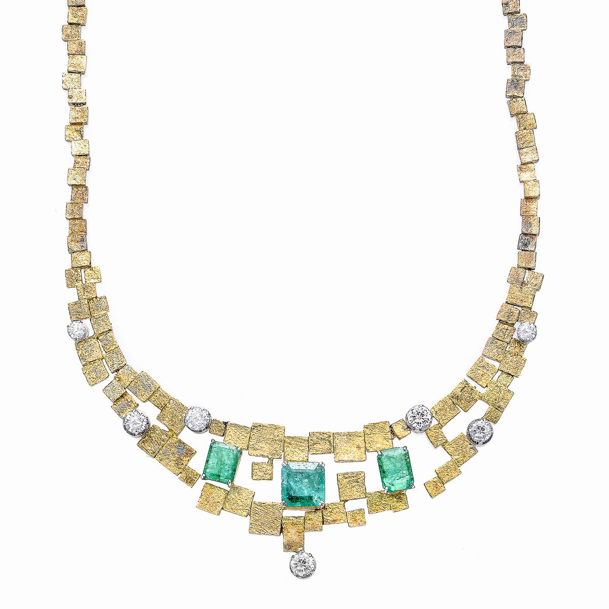 Importante parure in oro giallo, oro bianco, diamanti e smeraldi