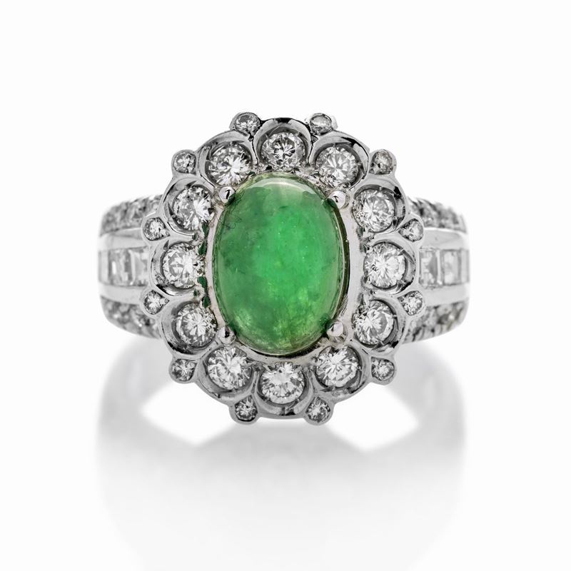 Anello in oro bianco, diamanti e smeraldo