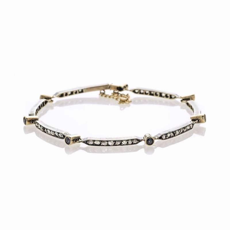 Bracciale in oro giallo, argento, zaffiri e diamante