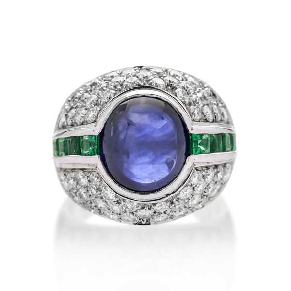 Ring in white gold, diamonds, emeralds and sapphire