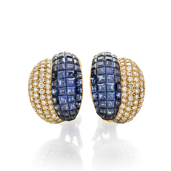Pair of clip earrings in yellow gold, diamonds and sapphires