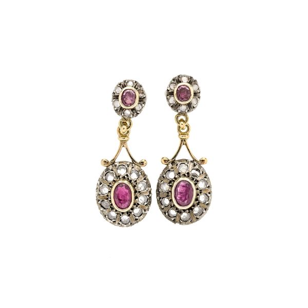 Pair of pendant earrings in yellow gold, gilded silver, diamonds and rubies