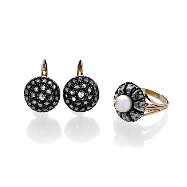 Pair of leverback earrings and ring in low title gold, silver, diamonds and pearl