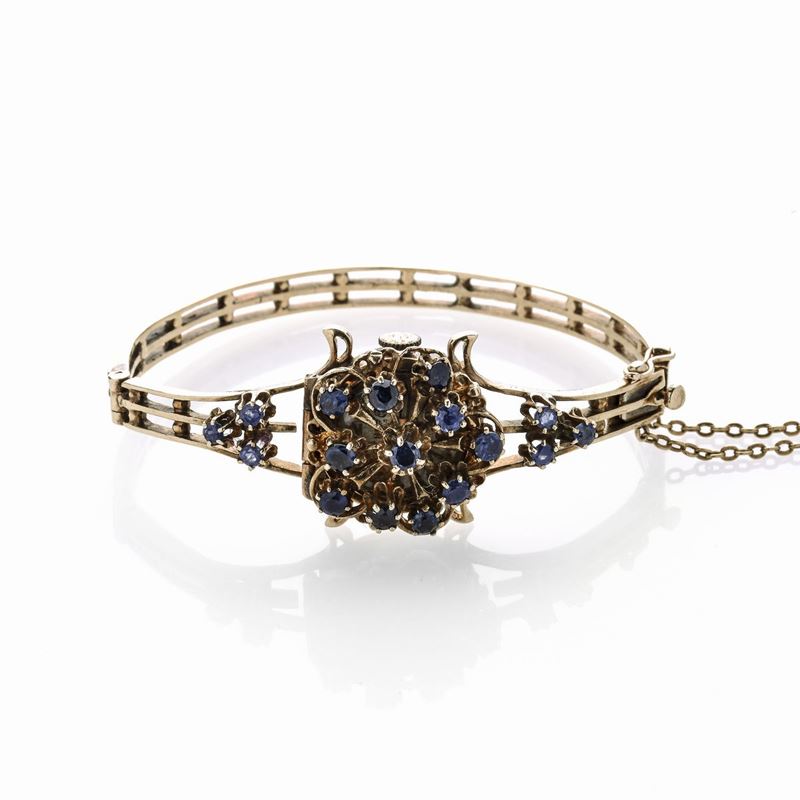 Bracciale orologio in oro a 14 kt e zaffiri