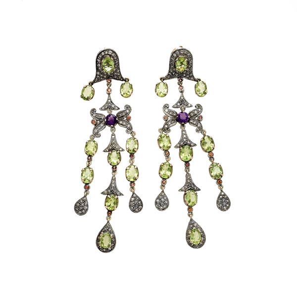 Long drop earrings in low gold, silver, diamonds, green peridots and amethyst