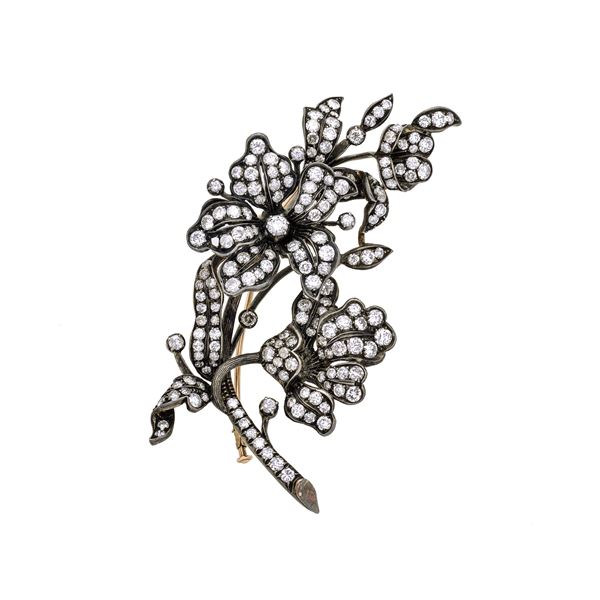 Floral brooch in sterling silver, low title gold and diamonds