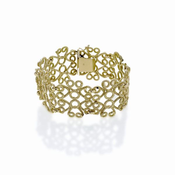 Alto bracciale in oro giallo