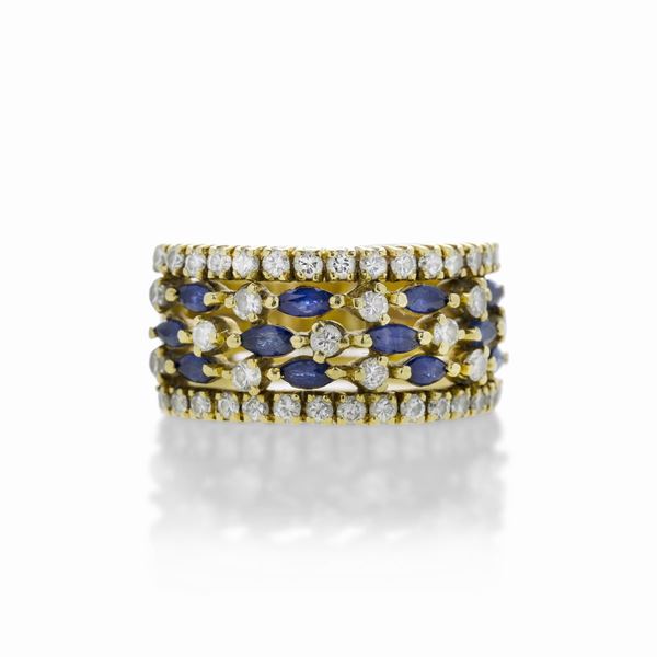 Anello a fascia in oro giallo, diamanti e zaffiri