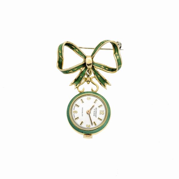 Spilla orologio in oro giallo e smalto verde