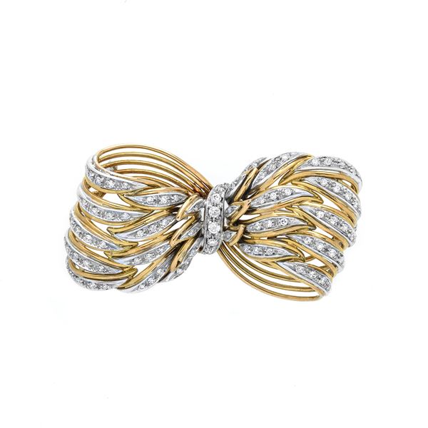 Bow brooch in yellow gold, white gold and diamonds