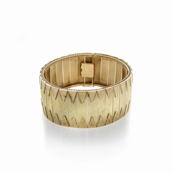 Alto bracciale in oro giallo