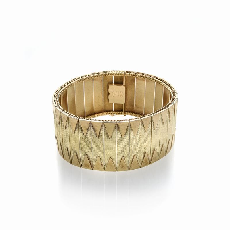 Alto bracciale in oro giallo