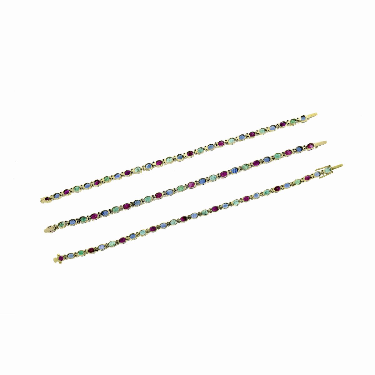 Tre bracciali trasformabili in collana in oro giallo 18 kt, diamanti, rubini, zaffiri e smeraldi