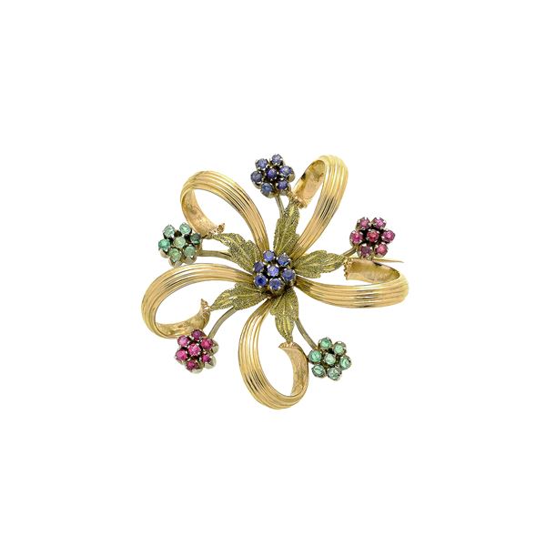 Floral brooch in yellow gold, sapphires, rubies and emeralds