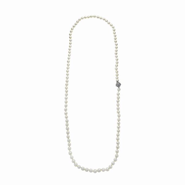 Long strand of cultured pearls, white gold and diamonds