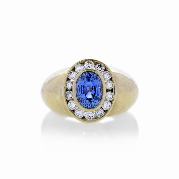 Man's ring in yellow gold, blu stone and diamond