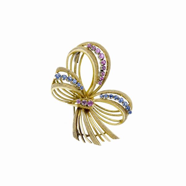 Bow brooch in yellow gold, sapphires and rubies