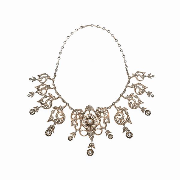 Floral necklace in low title gold and diamonds