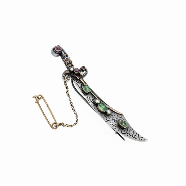 Scimitar brooch in sterling silver, low title gold, emeralds, pearls and rubies