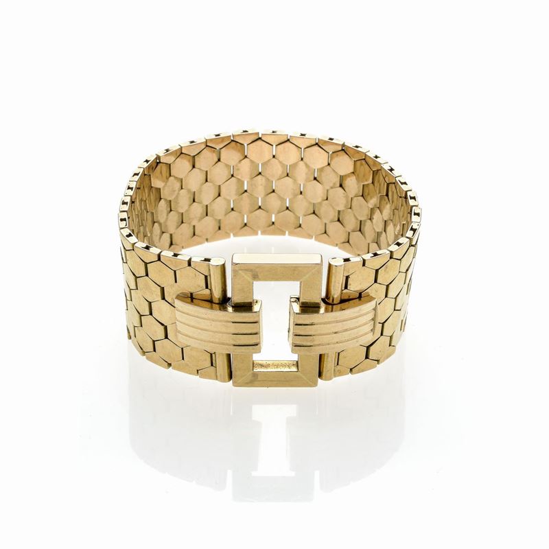 Alto bracciale in oro giallo