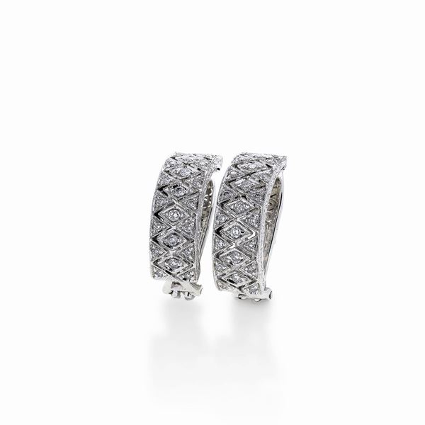 Pair of crescent earrings in white gold and diamonds