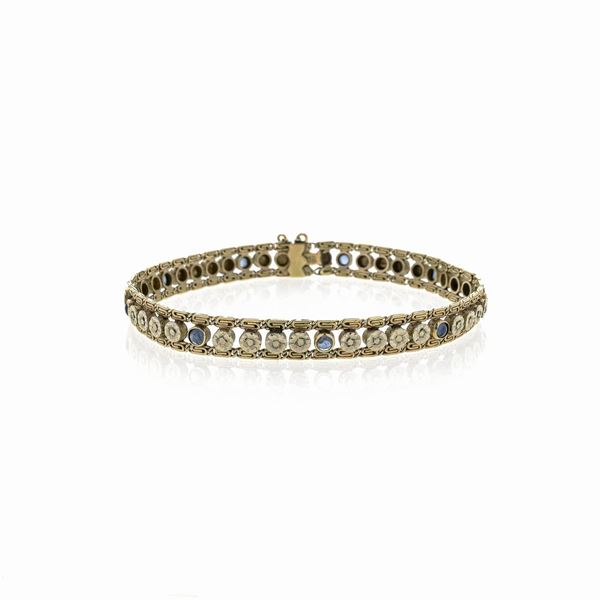 Bracelet in yellow gold, white gold and sapphires