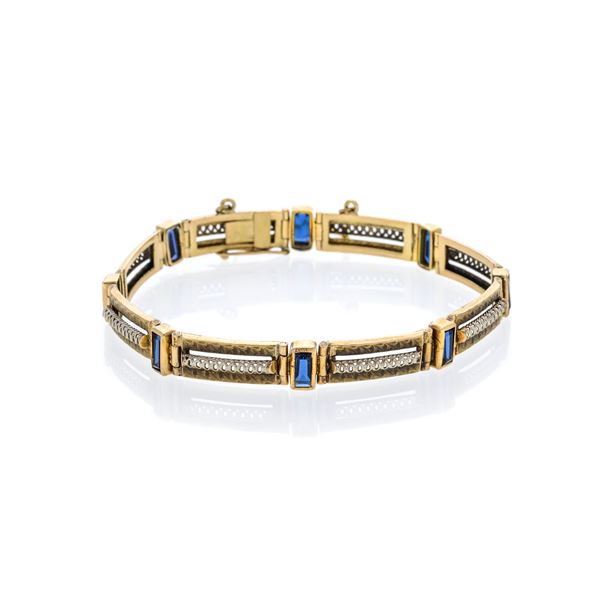 Bracelet in yellow gold, white gold and blue stones